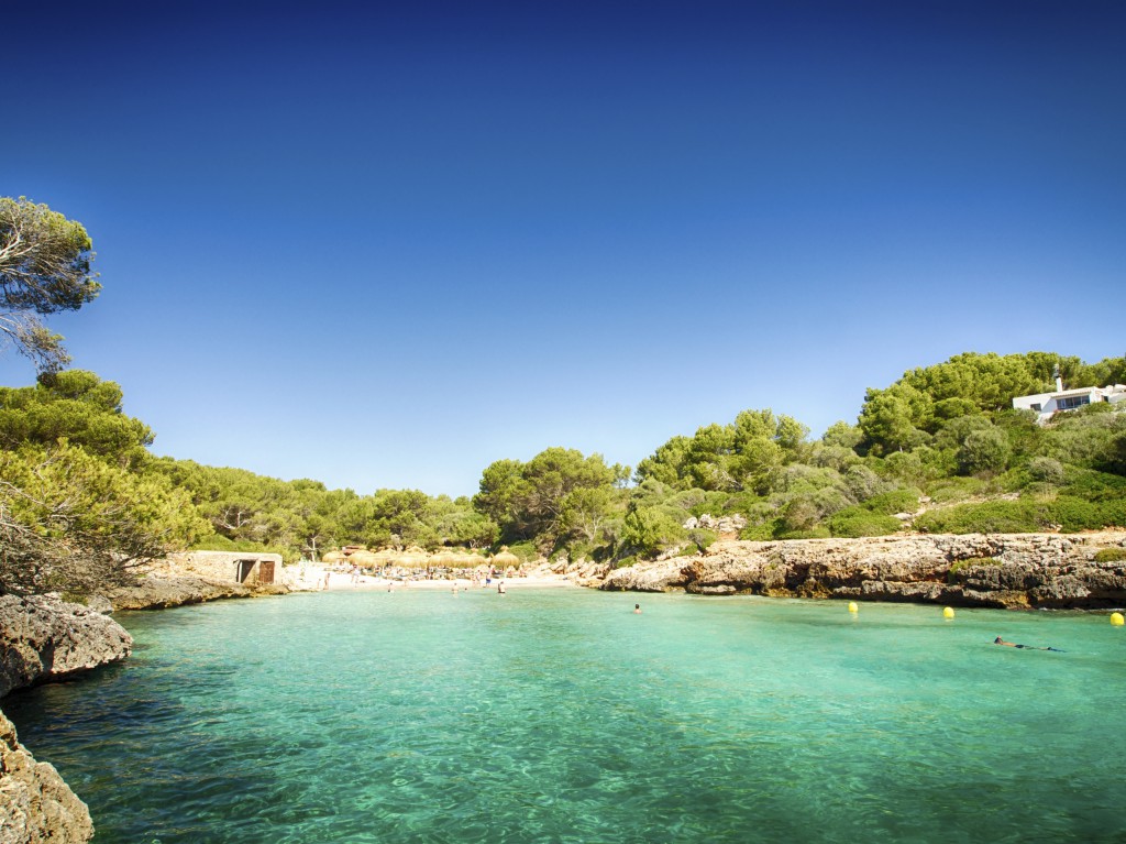 Calm sea and inviting beach make for an idyllic summer holiday scene.